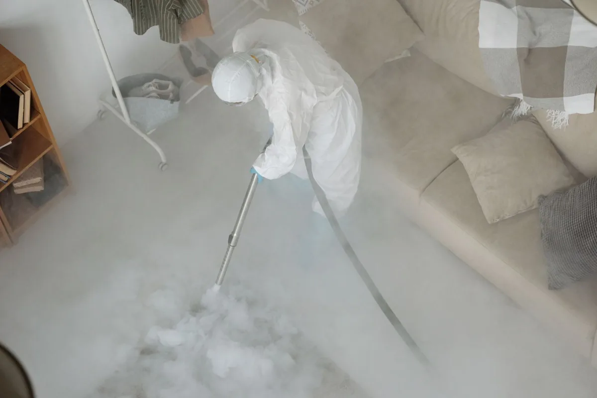 Biohazard cleanup technician in protective equipment, Corbin, KY